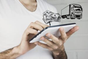 A man calculating damages in truck accident on the tablet 