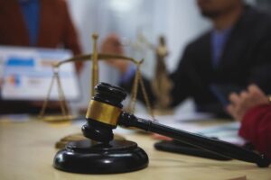 Lawyers in a meeting discuss case strategies, review evidence, prepare arguments, negotiate settlements, and collaborate on legal tactics 