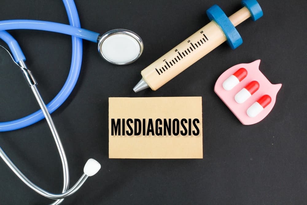 stethoscope, needle shape and medicine with the word Misdiagnosis. health and medical concepts
