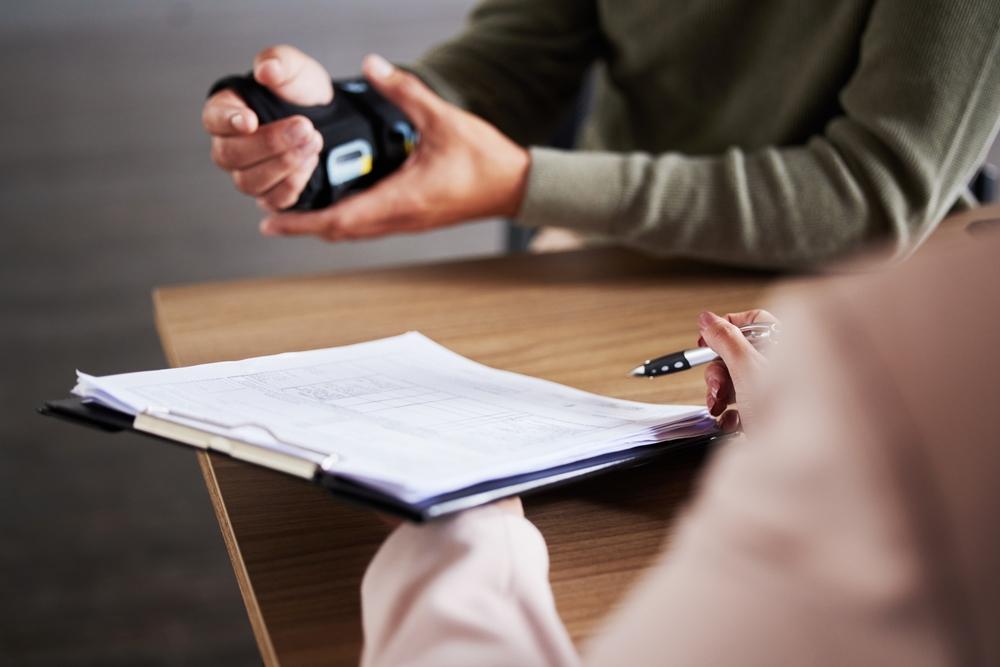 A lawyer and client reviewing documents together during a consultation about a personal injury case